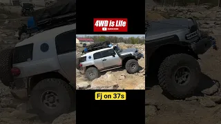 Toyota FJ cruiser on 37s Offroad climbing rock