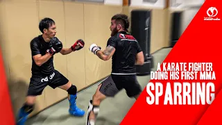 A karate fighter doing his first MMA sparring experience.