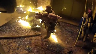 Helmet camera shows firefighter catching child thrown from burning apartment