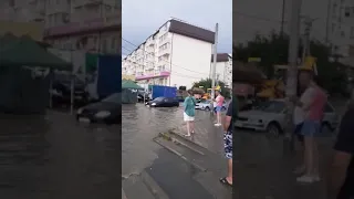 Torrential thunderstorm turns Krasnodar streets into rivers as tractor battles flooding