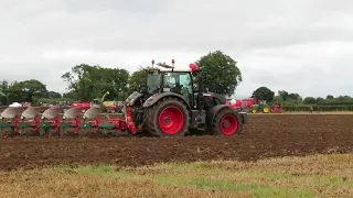 Black Fendt 724 ploughing with a 6 furrow auto reset Kverneland plough.