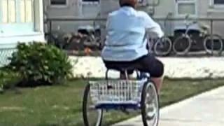 old lady falling off tricycle - YouTube.flv