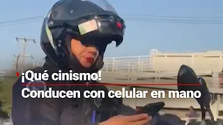 ¡Cachan a agente vial conduciendo con el celular en la mano, y multa al conductor que la graba!