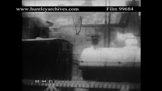 Shunter Reverses past level crossing, 1920's.  Archive film 99684