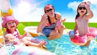 Baby born dolls at the swimming pool! Kids play toys & Feeding baby dolls in swimsuits.