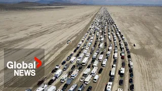 Burning Man exodus: Drone video shows thousands of vehicles trying to leave muddy desert festival