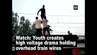 Watch: Youth creates high voltage drama holding overhead train wires