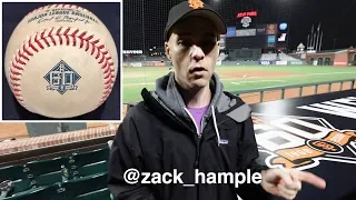 Giving away a commemorative baseball from AT&T Park