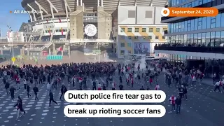 Police use tear gas to disperse rioting Ajax fans