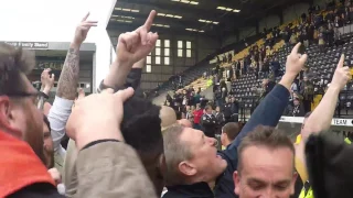 Amine Linganzi gets mobbed by Pompey fans as he leaves the pitch after promotion