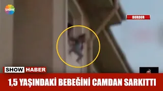 1,5 yaşındaki bebeğini camdan sarkıttı