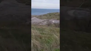 Грязевой вулкан на берегу моря. Mud volcano on the seashore.