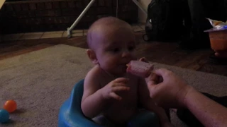 Grand baby eating popsicle