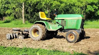 disking garden with 1975 John deere 400 and brinly double gang disk