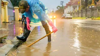 Removal Trash And Plastic Flow Clogged On Culvert Drain On Street Road After Rain