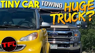 Can I Tow a GIANT Truck With A TINY Car? | Ford F-250 vs Electric Smart Car!