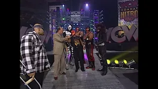 Konnan bullies an Injured Rey Mysterio during Promo. WCW Luchadores Stand Up for Rey! 1997