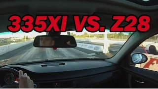 BMW 335xi vs. Camaro Z28 (1/4 mile Drag Race)