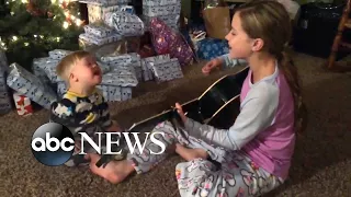 Toddler with Down syndrome sings with sister in video thanks to music therapy