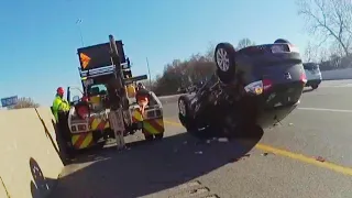 Driver Screams as Tow Truck Flips Car With Him Still Inside