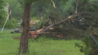 Surveying tornado damage in Navarro County, where neighbors are clearing debris after Friday's storm