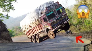 Heavy Loaded Truck Front Wheels in Air While Driving in Ghat Road - Truck Driver Difficulties