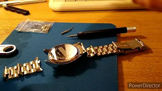 Fitting a metal watch strap with curved ends. Change a leather watch strap to a stainless steel one