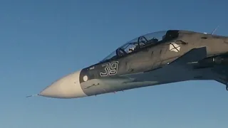 Russian SU-30 fighter intercept and escort  Boeing P-8  US Navy spy plane