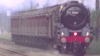 70013 Oliver Cromwell drops coal at speed.