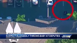 Suspect allegedly throws baby at deputies