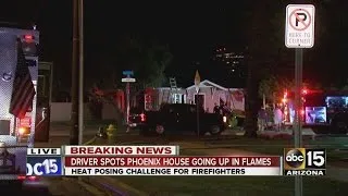 Driver spots Phoenix house going up in flames