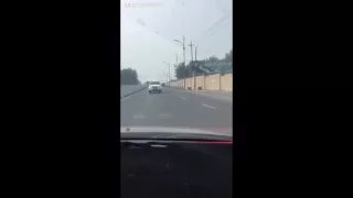 Man drives Car backwards on road at normal speed in China [VIDEO]