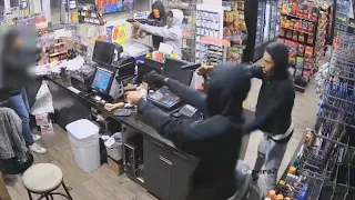 video shows clerk bombarded by 4 gunmen during robbery at SW Houston gas station