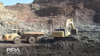 Komatsu PC800 loading rock into a fleet of Volvo A40 trucks.