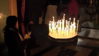 Jesus dies on the Cross - Praying with Candles at the Church of Holy Sepulchre in Jerusalem