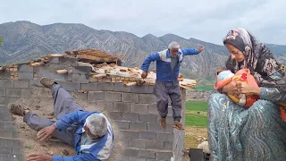 Spring rain, the family is trying to carry things inside the hut