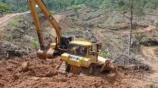 Bulldozer D6R XL And Long Arm Excavator Stuck Into A Ravine In An Oil Palm Plantation