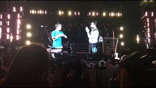 Chris Martin inviting a fan on stage to play O (Fly On) for Las Vegas