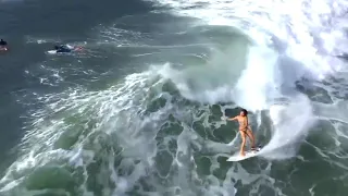 Expert Female Surfer Rides Wave in Bali - 1019720