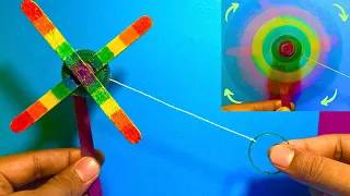 A Rainbow Spinning toy which you can easily make with ice cream sticks | A Ice cream stick fan toy