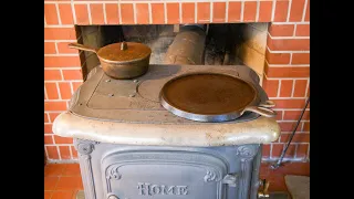 Cooking On A Wood Burning Stove With Cast Iron Cookware Creating Delicious Comfort Food.