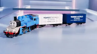 Thomas coupled with Tomix freight cars.Thomas and friends!