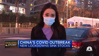 China stocks sink as Covid outbreak brings fresh lockdowns