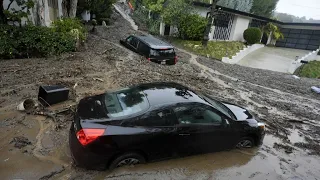 Historic storm sends debris through LA's Hollywood Hills and leaves 1.1 million without power