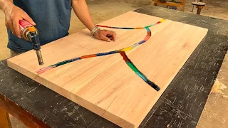 The Carpenter With Black Wooden Blocks Created A Table With The Highlight Of A Colorful Tree Branch