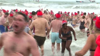 Thousands of swimmers brave the cold in the North Sea