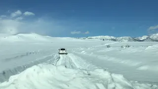 Toyota 4-Runner and Landcruiser 200 plowing thru Snow trail blazing Lake crowley