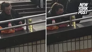 Woman munches on raw meat outside a train station | New York Post