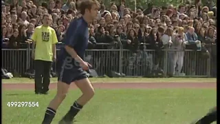 Liam Gallagher playing football with robbie Williams and Damon Albarn