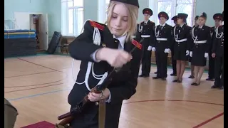 Beautiful Russian School girl assembling an AK-47 in seconds